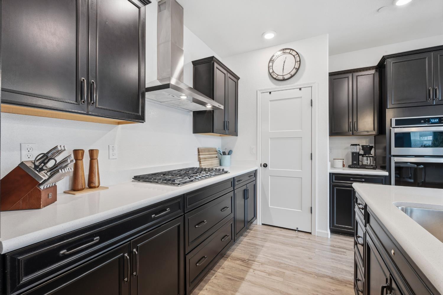7240 Encore Way Roseville, CA 95747 - Photo 6 of 52 a kitchen with stainless steel appliances granite countertop a stove and a refrigerator