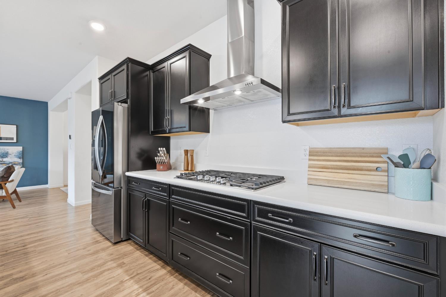 7240 Encore Way Roseville, CA 95747 - Photo 8 of 52 a kitchen with stainless steel appliances granite countertop a sink stove and refrigerator