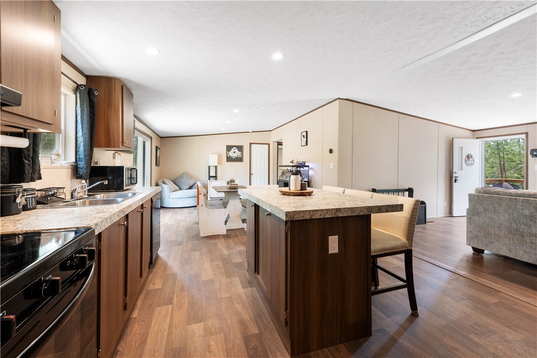 309 Tanglewood Lane Somerville, TX 77879 - Photo 21 of 21 a kitchen with a sink appliances and cabinets
