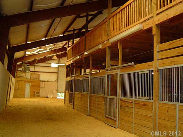 2626 Medlin Road Monroe, NC 28112 - Photo 6 of 16 a view of a garage with wooden wall