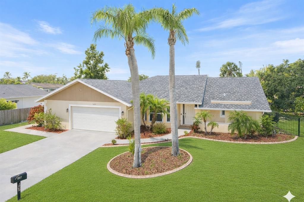 1627 Del Monte Court Venice, FL 34293 - Photo 1 of 78 a front view of a house with a yard