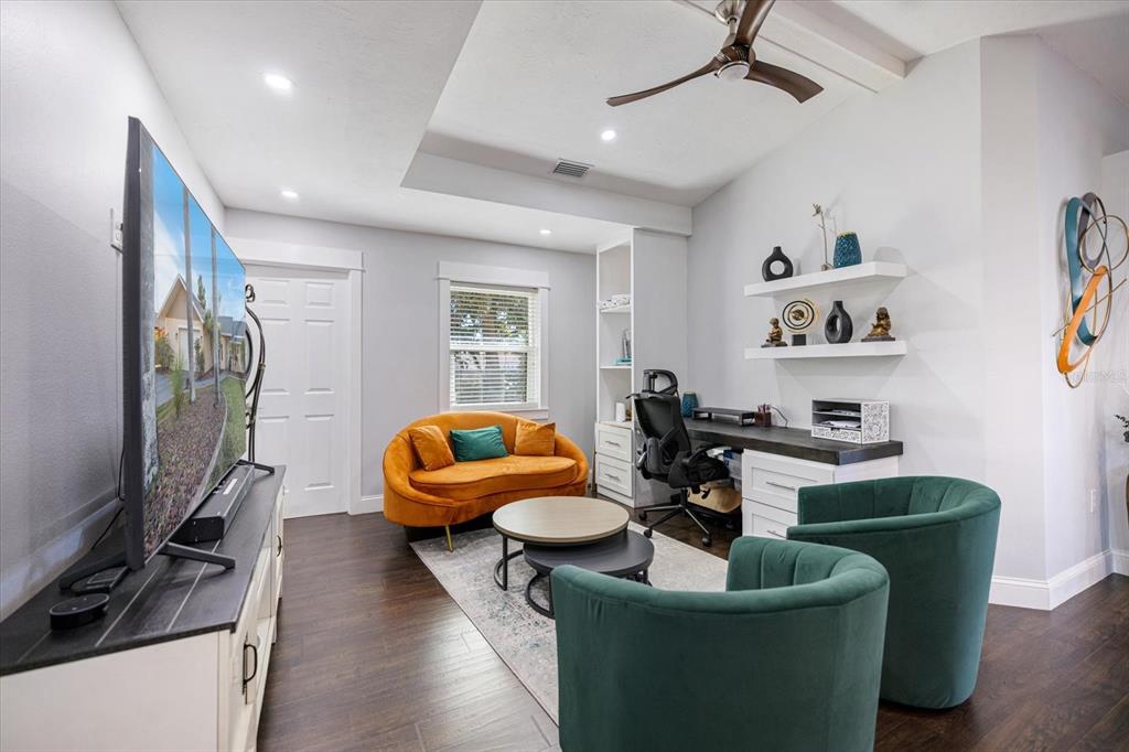 1627 Del Monte Court Venice, FL 34293 - Photo 16 of 78 a living room with furniture and a flat screen tv