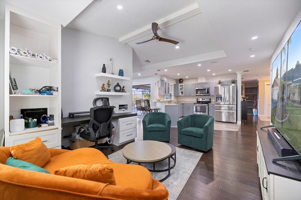 1627 Del Monte Court Venice, FL 34293 - Photo 18 of 78 a living room with furniture and a dining table with kitchen view