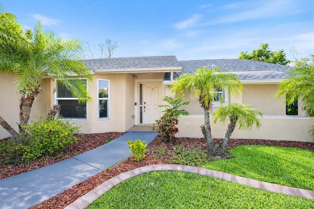 1627 Del Monte Court Venice, FL 34293 - Photo 2 of 78 a front view of a house with a yard