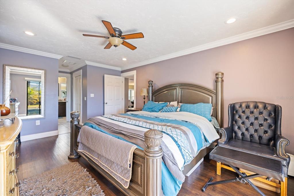 1627 Del Monte Court Venice, FL 34293 - Photo 21 of 78 a bedroom with a bed and lamp