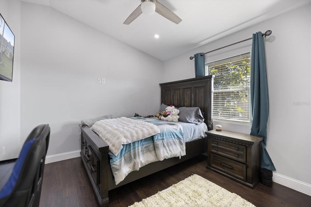1627 Del Monte Court Venice, FL 34293 - Photo 25 of 78 a bed sitting in a bedroom next to a window