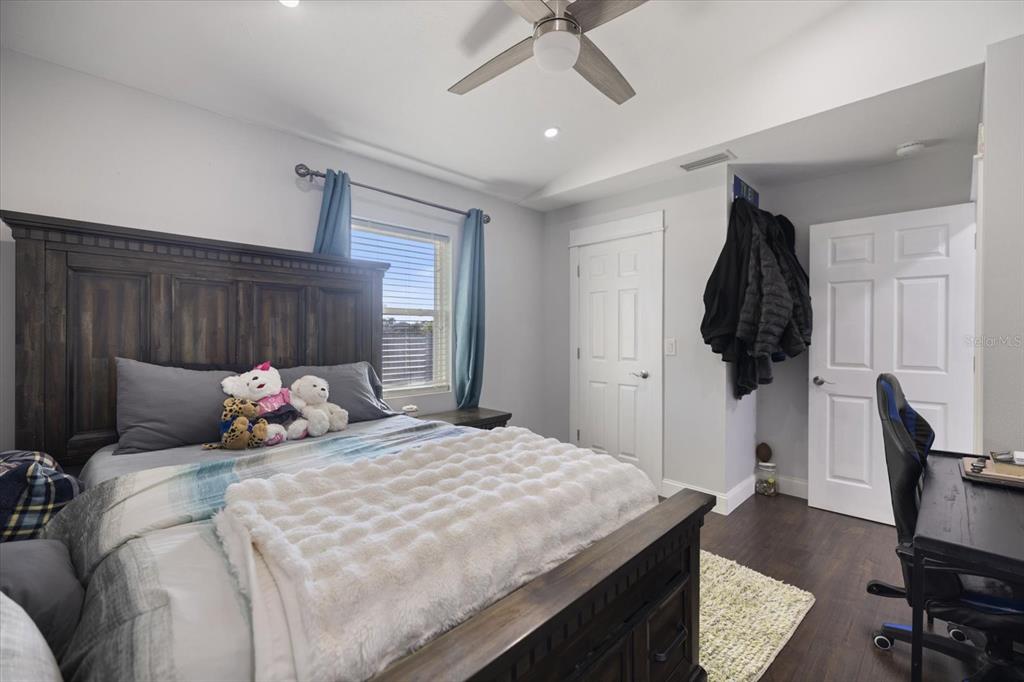 1627 Del Monte Court Venice, FL 34293 - Photo 26 of 78 a bedroom with a bed and teddy bear on the dresser
