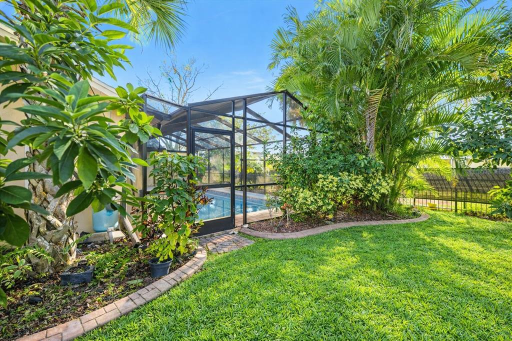 1627 Del Monte Court Venice, FL 34293 - Photo 37 of 78 a view of a chair and table in the garden