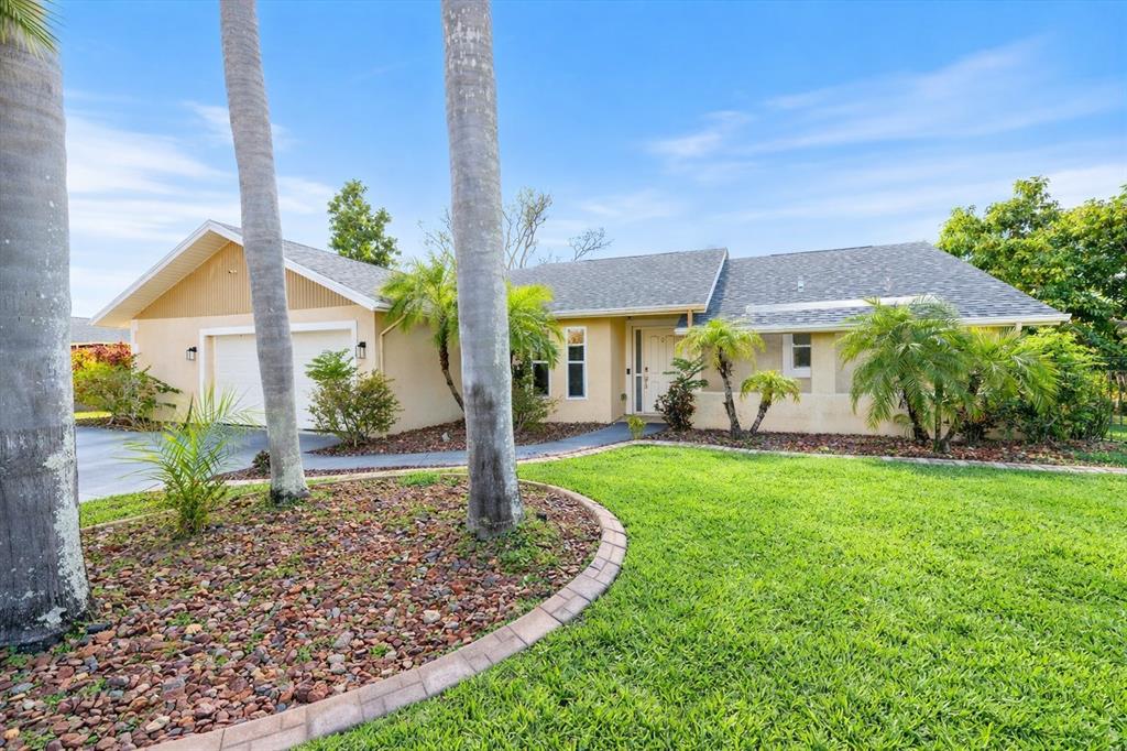1627 Del Monte Court Venice, FL 34293 - Photo 42 of 78 a front view of a house with garden