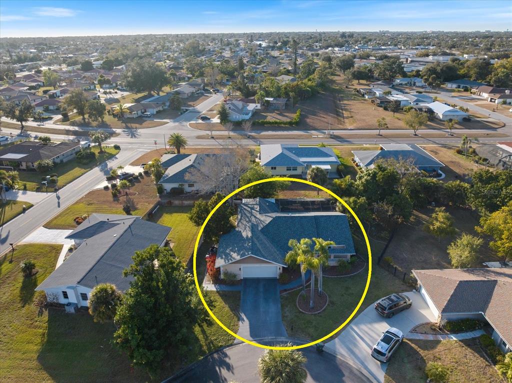 1627 Del Monte Court Venice, FL 34293 - Photo 45 of 78 an aerial view of a swimming pool with a yard