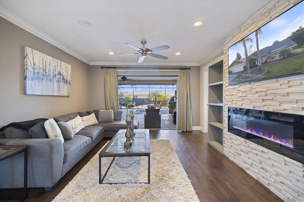 1627 Del Monte Court Venice, FL 34293 - Photo 6 of 78 a living room with furniture and a fireplace