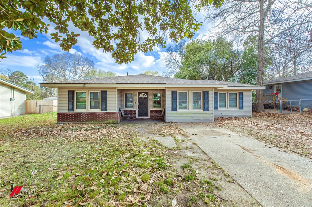 Ranch-style house featuring brick siding