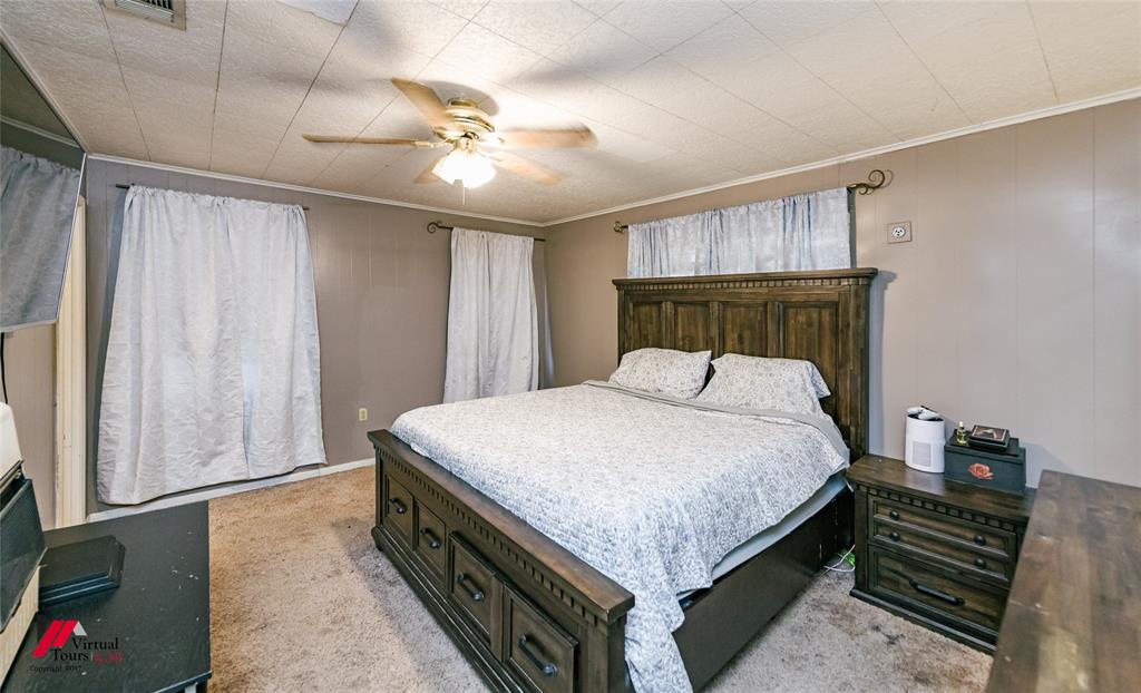 214 Ellis Drive Minden, LA 71055 - Photo 17 of 30 Bedroom with a ceiling fan, light carpet, and crown molding