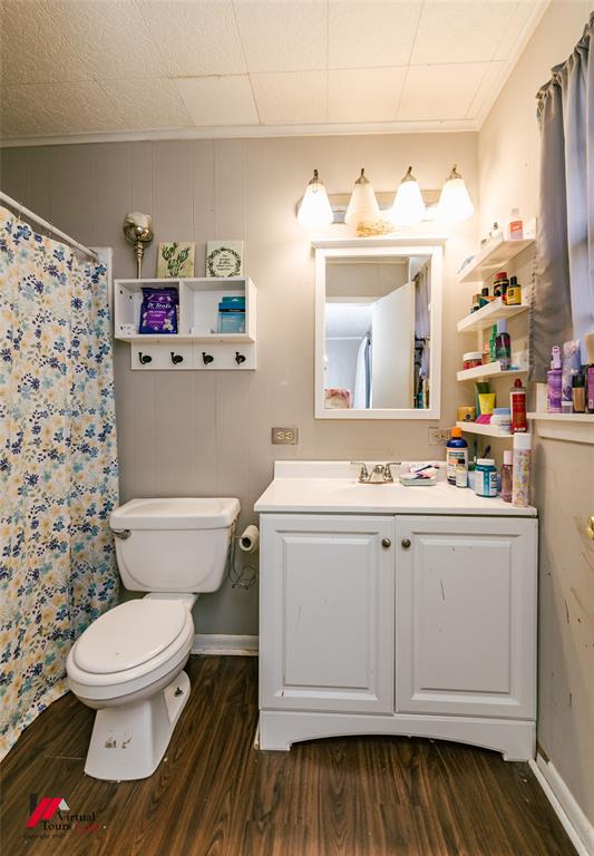 214 Ellis Drive Minden, LA 71055 - Photo 20 of 30 Full bath with vanity, dark wood-type flooring, a shower with curtain, and crown molding
