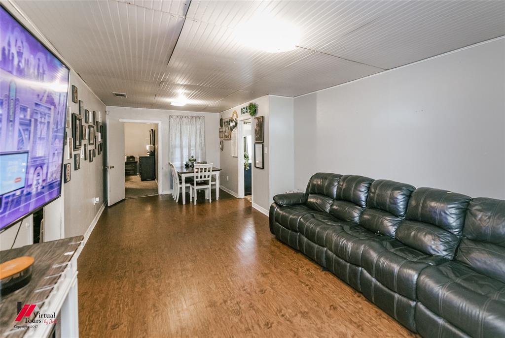 214 Ellis Drive Minden, LA 71055 - Photo 24 of 30 Living area with wood finished floors and baseboards