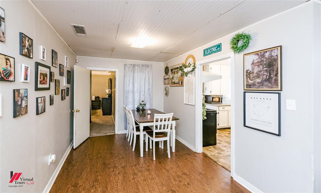 214 Ellis Drive Minden, LA 71055 - Photo 6 of 30 Dining space featuring dark wood-style flooring and baseboards