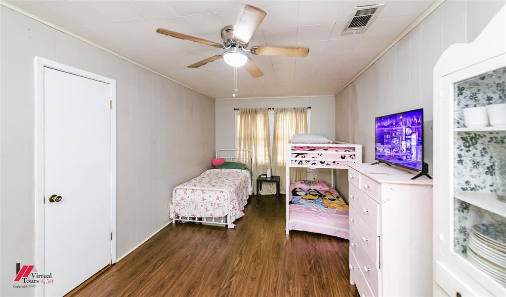 214 Ellis Drive Minden, LA 71055 - Photo 7 of 30 Bedroom featuring dark wood-style flooring and ceiling fan