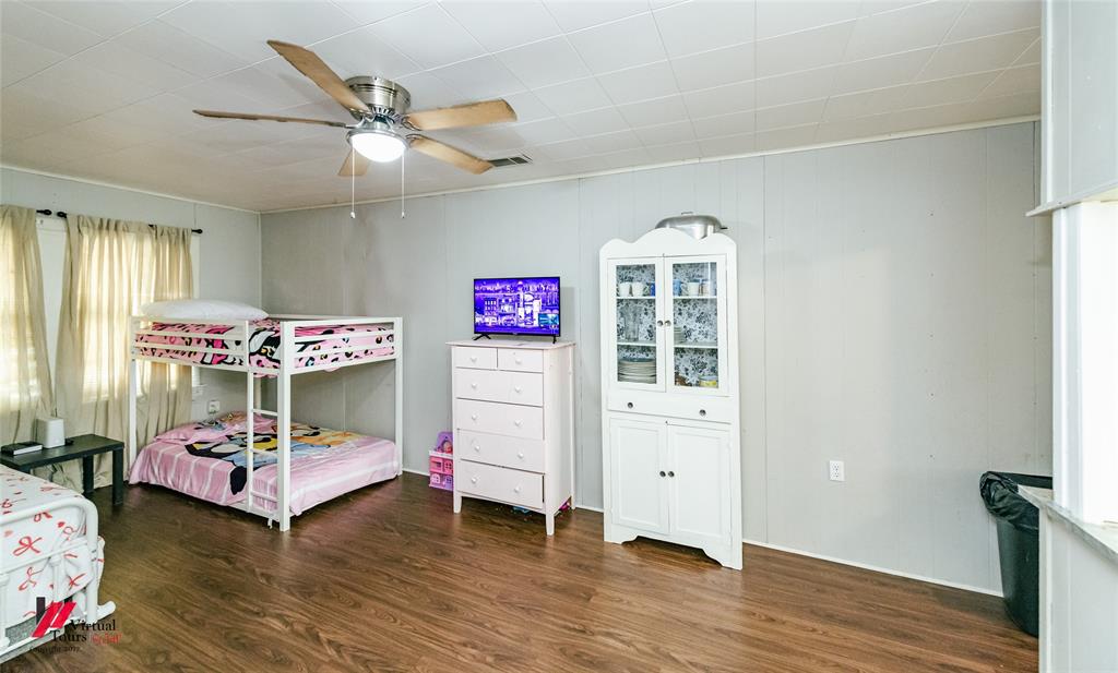 214 Ellis Drive Minden, LA 71055 - Photo 8 of 30 Bedroom with dark wood-type flooring and a ceiling fan