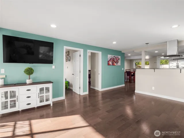 a view of a livingroom with furniture and a flat screen tv