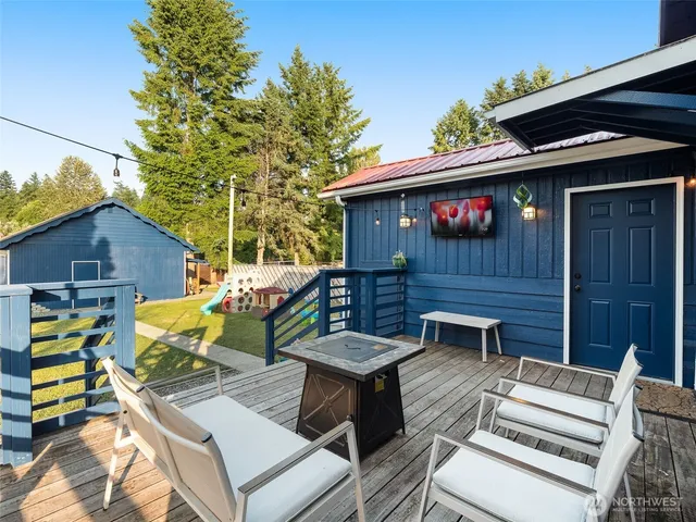 a view of a chairs and table in the patio