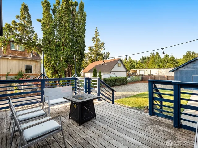 swimming pool view with a seating space