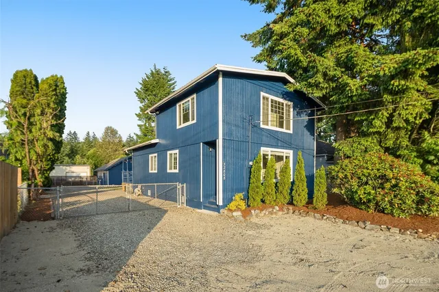 a front view of a house with garden