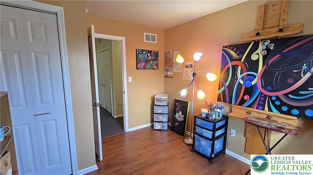 194 Springhouse Road Allentown, PA 18104 - Photo 24 of 34 This versatile room features warm flooring and ample natural light, ideal for creative pursuits or a cozy retreat.