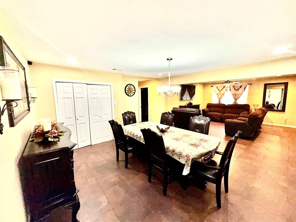5216 Terrace Trail Sansom Park, TX 76114 - Photo 17 of 34 a view of a dining room with furniture and chandelier