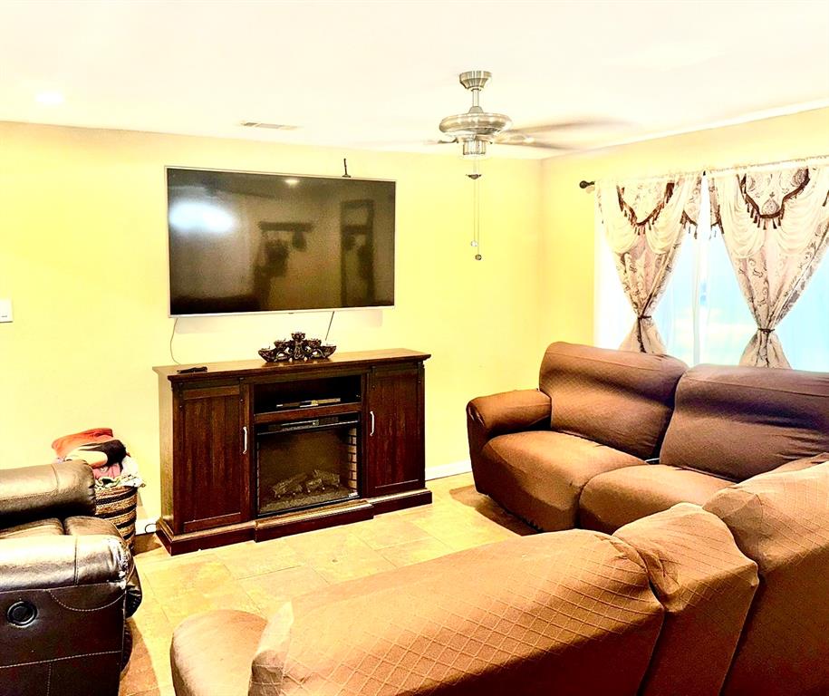 5216 Terrace Trail Sansom Park, TX 76114 - Photo 18 of 34 a living room with furniture and a fireplace