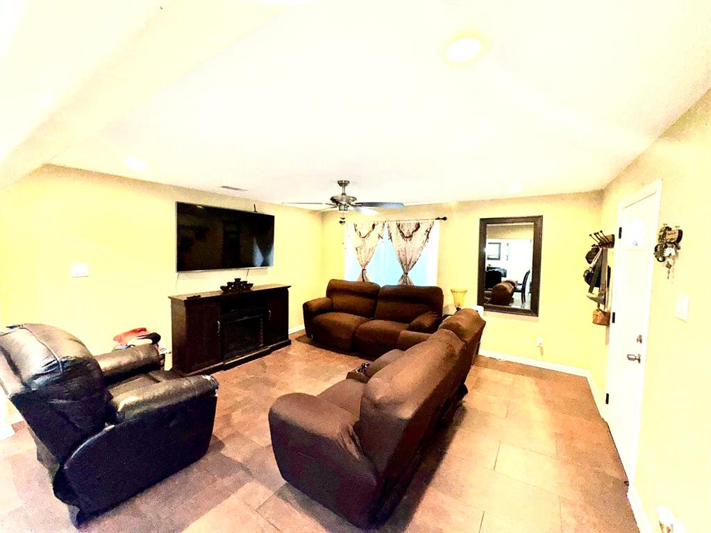 5216 Terrace Trail Sansom Park, TX 76114 - Photo 20 of 34 a living room with furniture and a flat screen tv