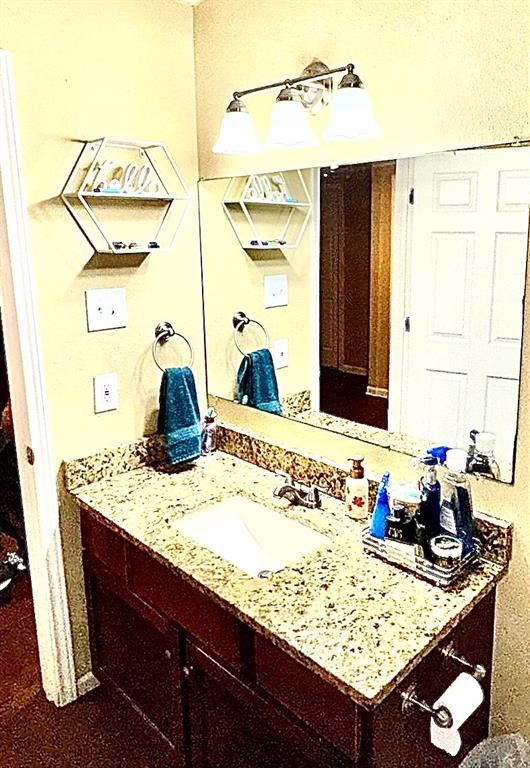 5216 Terrace Trail Sansom Park, TX 76114 - Photo 22 of 34 a bathroom with a granite countertop sink and a mirror