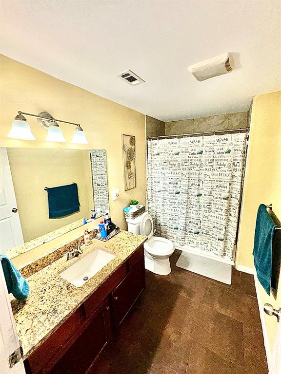 5216 Terrace Trail Sansom Park, TX 76114 - Photo 26 of 34 a bathroom with a granite countertop sink toilet and shower