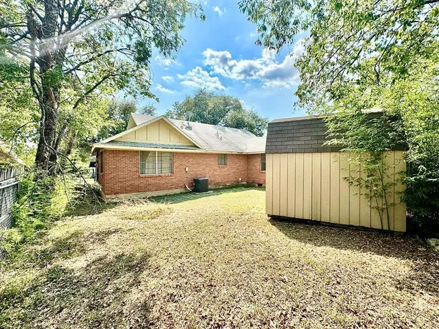 a house with trees in the background