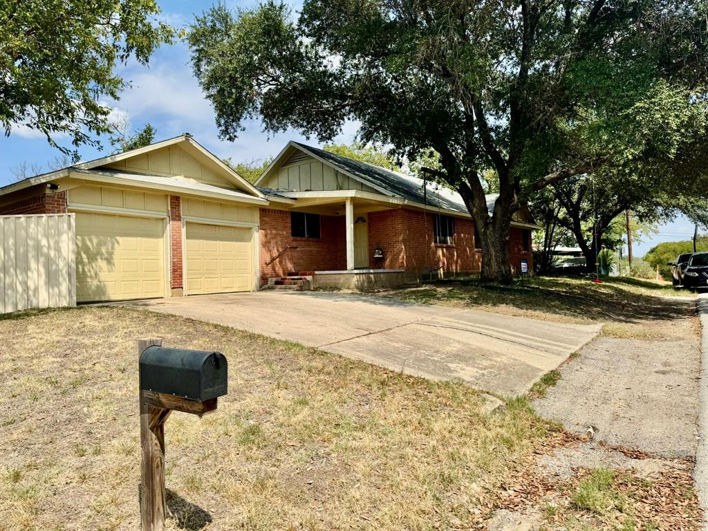 5216 Terrace Trail Sansom Park, TX 76114 - Photo 7 of 34 a front view of a house with a yard
