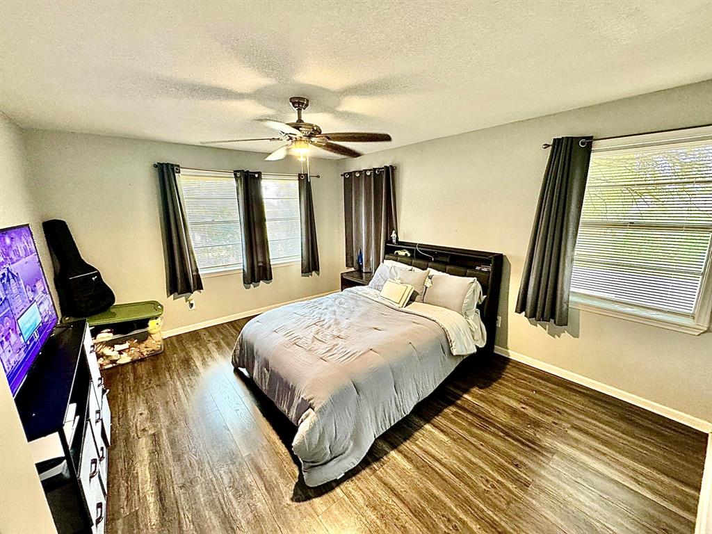 5216 Terrace Trail Sansom Park, TX 76114 - Photo 10 of 34 a bedroom with a bed dresser and a window