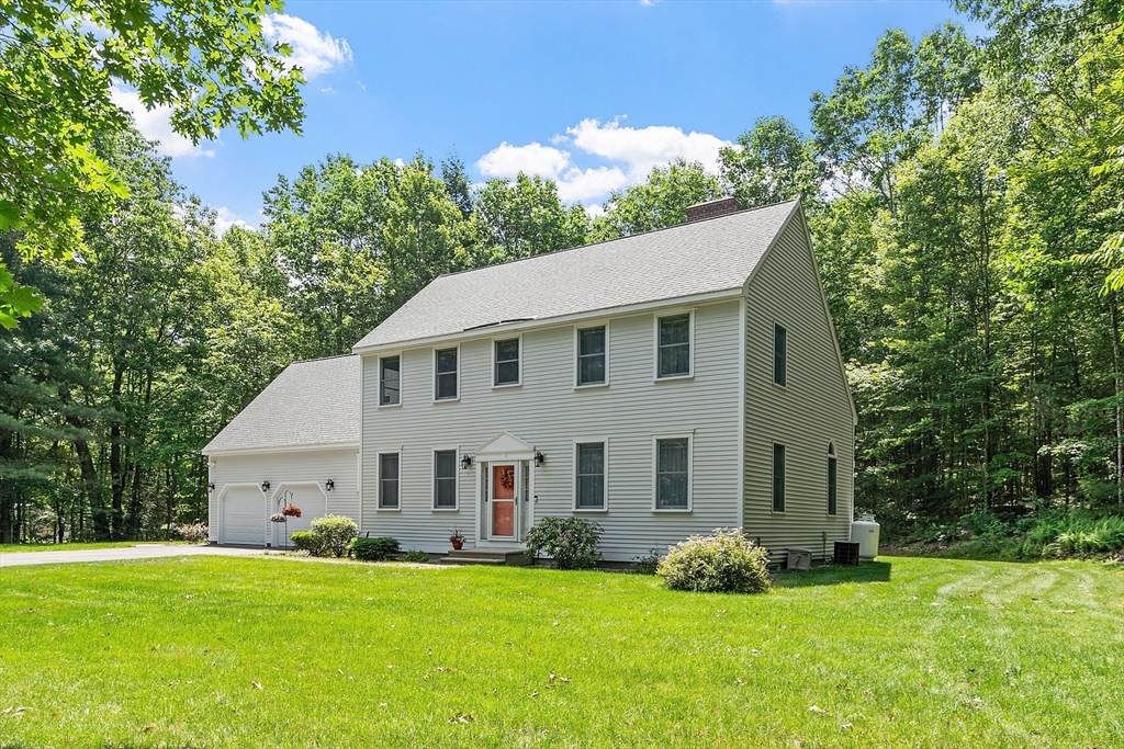 169 Narrows Road Westminster, MA 01473 - Photo 1 of 41 a view of a white house with a big yard and large trees