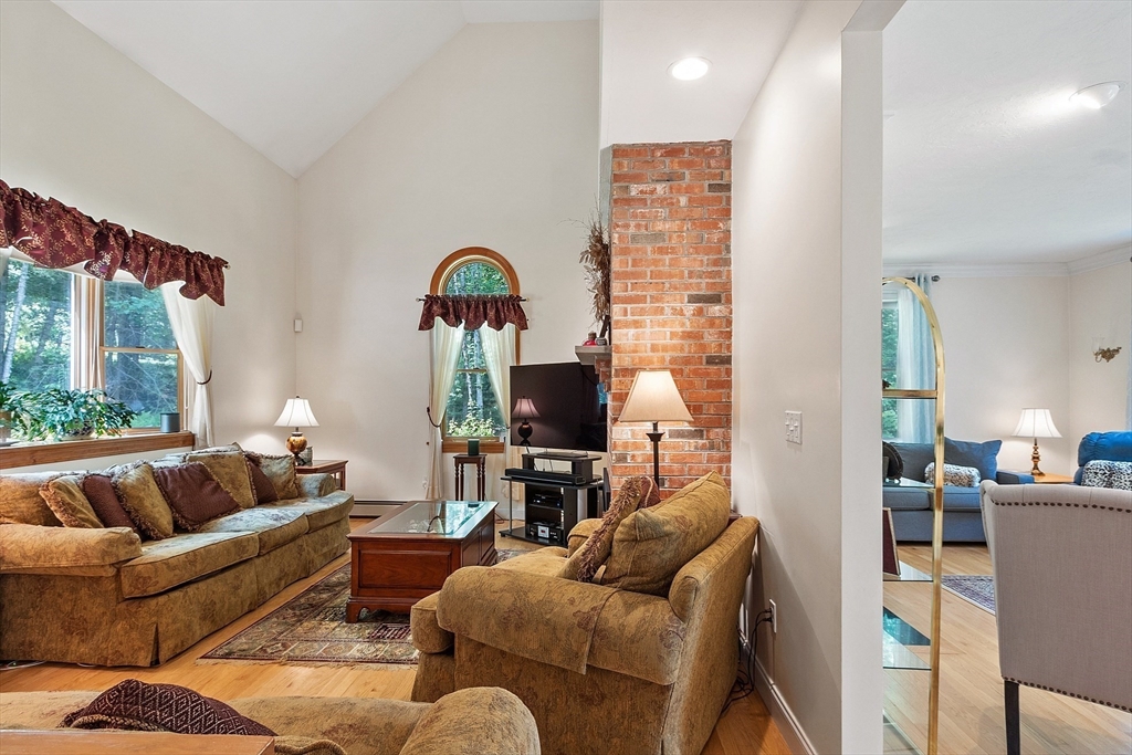 169 Narrows Road Westminster, MA 01473 - Photo 13 of 41 a living room with furniture a large window and a flat screen tv