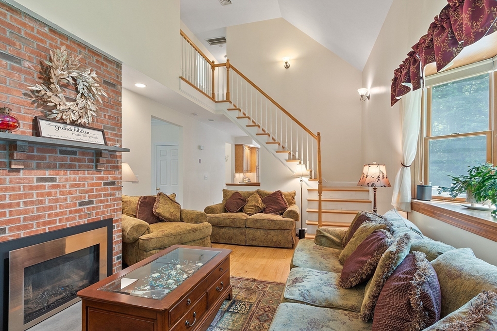 169 Narrows Road Westminster, MA 01473 - Photo 15 of 41 a living room with furniture and a fireplace