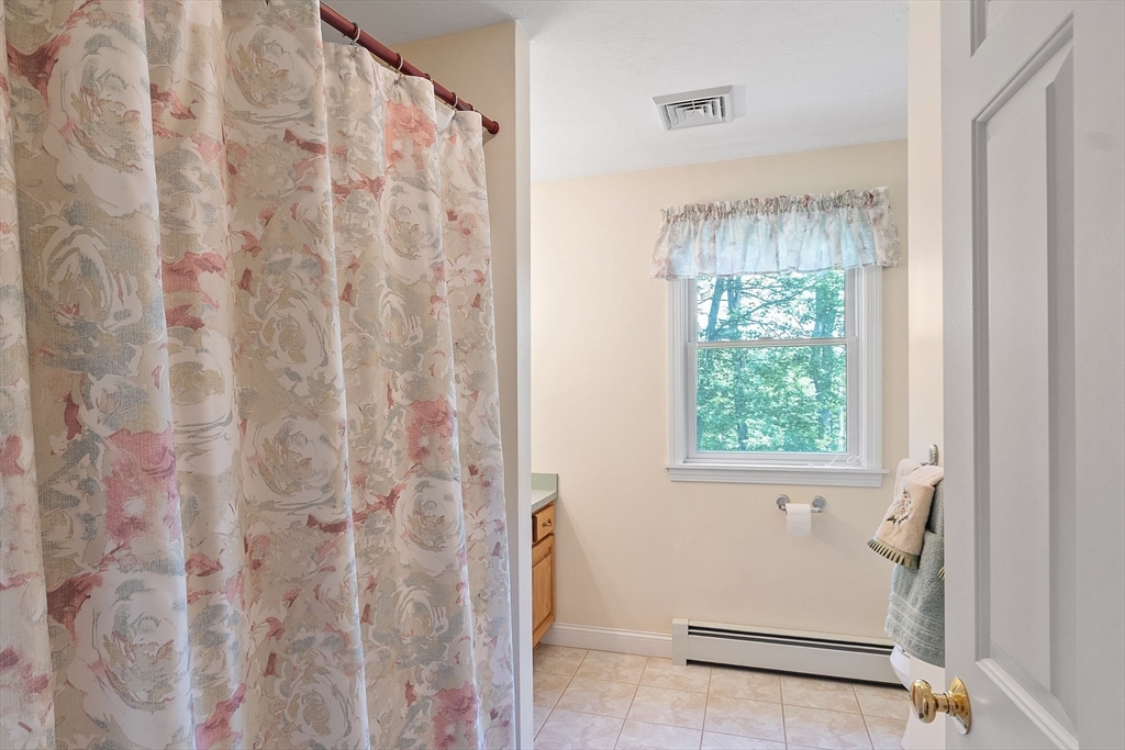 169 Narrows Road Westminster, MA 01473 - Photo 25 of 41 a bathroom with a window and a shower