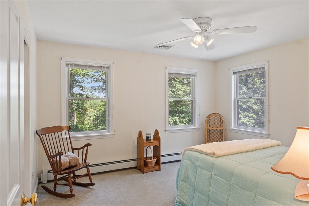 169 Narrows Road Westminster, MA 01473 - Photo 27 of 41 a bed room with a bed and a chair