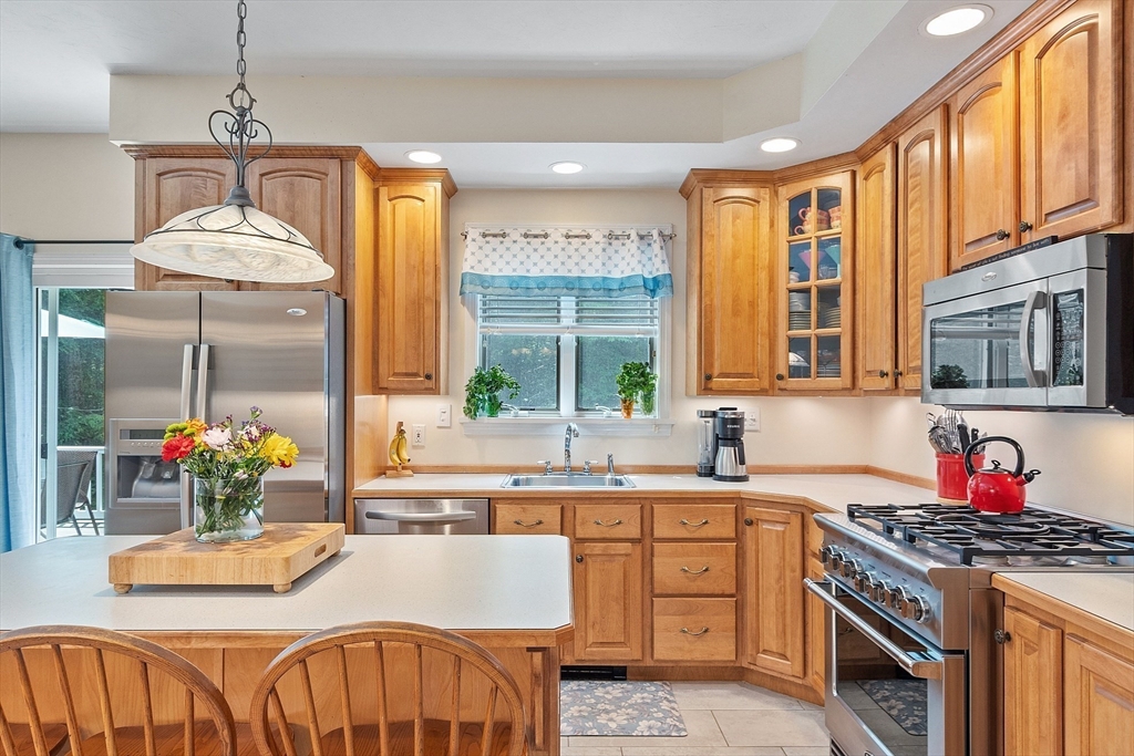 169 Narrows Road Westminster, MA 01473 - Photo 6 of 41 a kitchen with granite countertop a stove a sink and a dining table