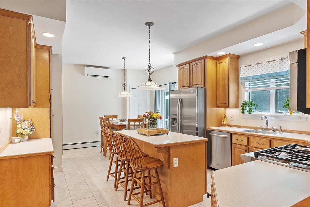 169 Narrows Road Westminster, MA 01473 - Photo 8 of 41 a kitchen with stainless steel appliances kitchen island granite countertop a stove a sink a refrigerator and island