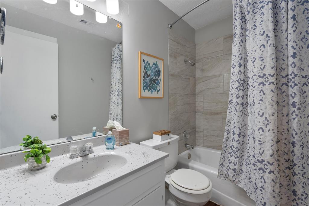 1711 Rawhide Loop Round Rock, TX 78681 - Photo 11 of 14 Bathroom featuring shower / bath combo and vanity