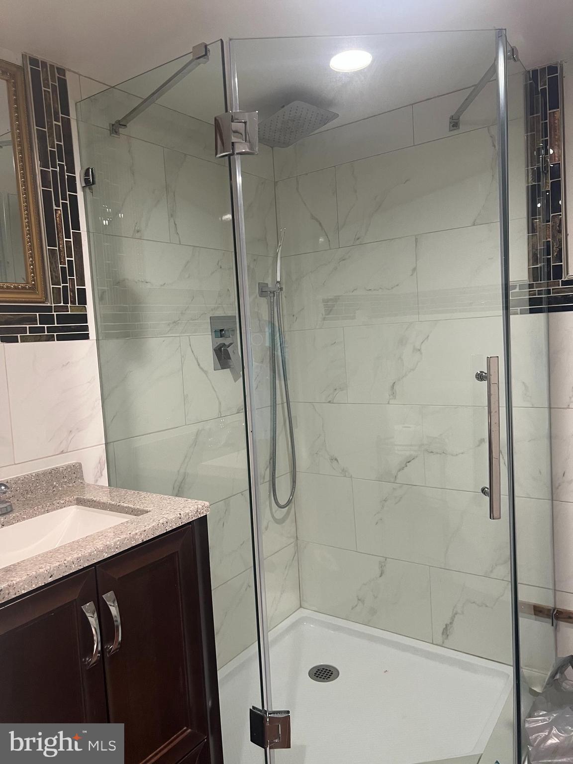 330 Sanger Street Philadelphia, PA 19120 - Photo 5 of 18 a bathroom with a shower and a sink