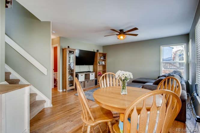9629 Sydney Lane Highlands Ranch, CO 80130 - Photo 12 of 34 a view of a dining room with furniture and wooden floor
