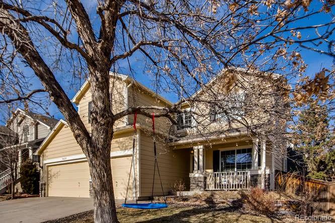 9629 Sydney Lane Highlands Ranch, CO 80130 - Photo 2 of 34 a front view of a house with parking tree