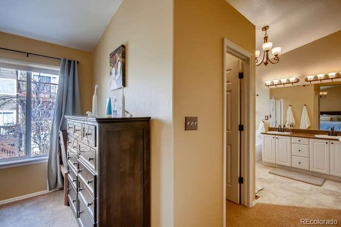 9629 Sydney Lane Highlands Ranch, CO 80130 - Photo 21 of 34 a view of a bathroom from a hallway