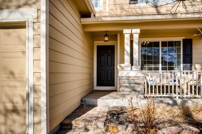 9629 Sydney Lane Highlands Ranch, CO 80130 - Photo 3 of 34 a view of entrance door of the house