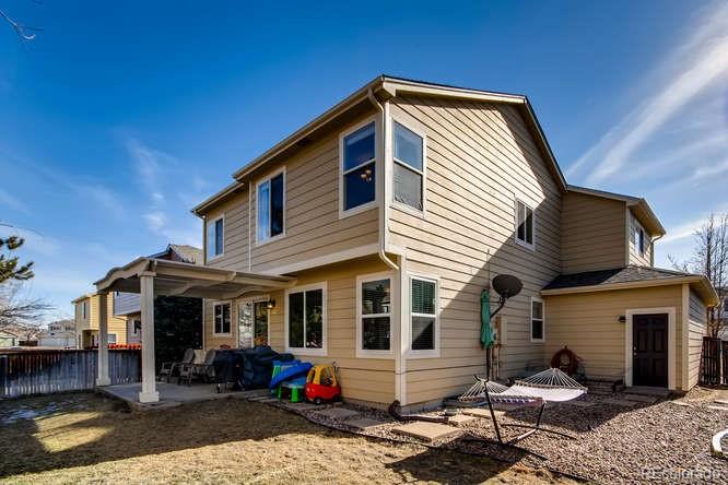 9629 Sydney Lane Highlands Ranch, CO 80130 - Photo 33 of 34 a front view of a house with a patio