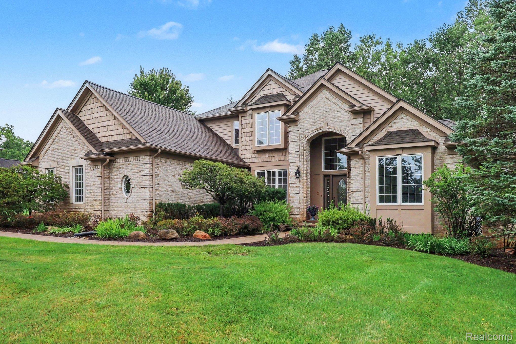 4875 Green Meadow Lane Rochester, MI 48306 - Photo 4 of 60 Brick and shingle exterior with multiple gables